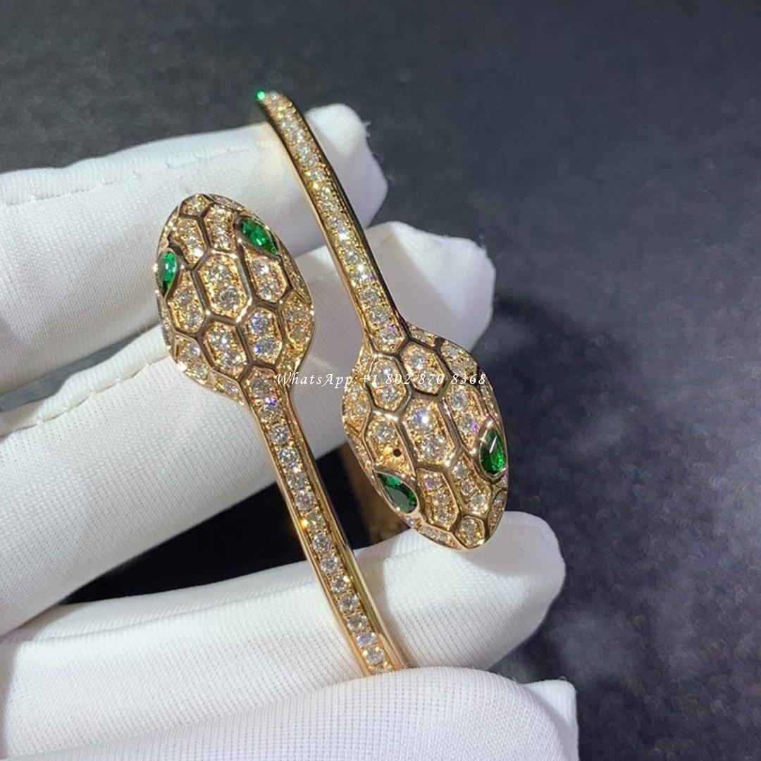 Bulgari Serpenti 18 kt yellow gold bracelet set with emerald eyes and pavé diamonds